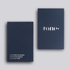 two business cards with the word tono printed on them, both in white ink