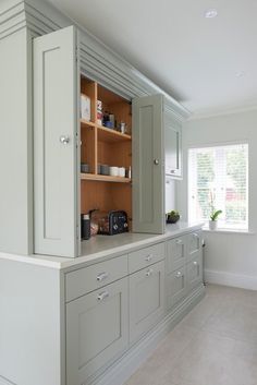 an empty kitchen with cabinets and counter tops