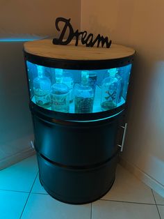 a display case with bottles in it that says dream on the top and bottom shelf