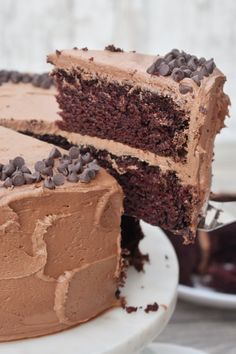 a chocolate cake with one slice cut from it