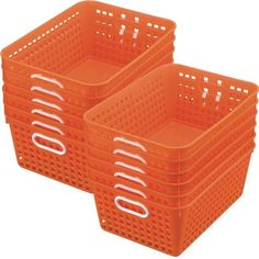 two orange plastic baskets sitting next to each other