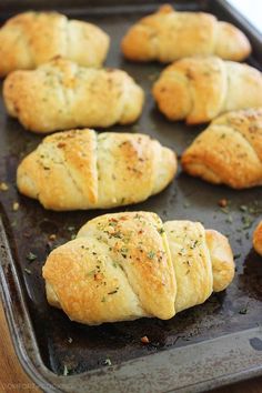 freshly baked croissants on a baking sheet