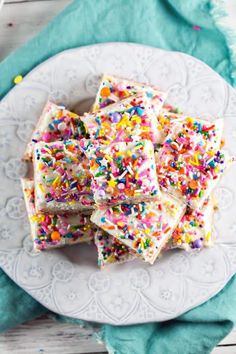 white cake with sprinkles on a plate