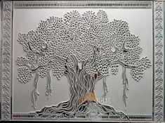 an intricately designed metal artwork depicting a tree