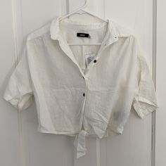 Nwot, Never Been Worn Ivory Color Size Xs. Relaxed Fit 55% Linen, 45% Rayon White Button-up Crop Top For Summer, White Cropped Shirt For Summer, Chic White Cropped Shirt, White Short Sleeve Crop Top For Day Out, White Button-up Tops For Summer, White Button-up Summer Tops, Urban Outfitters White Spring Blouse, Urban Outfitters White Short Sleeve Crop Top, Chic White Blouse From Urban Outfitters