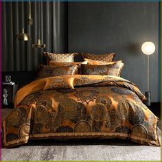 the bed is made with an intricately designed comforter and matching pillowcases