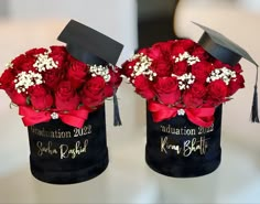 two graduation hats decorated with red roses and baby's breath