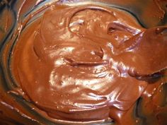 chocolate spread in a metal bowl on top of a table