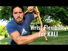 a man holding a baseball bat over his shoulder with the words wrist flexibility for kali