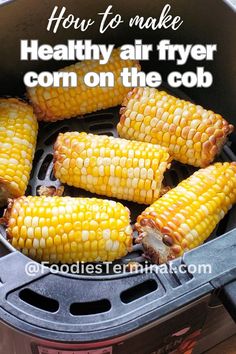 corn on the cob in an air fryer with text overlay that reads how to make healthy air fryer corn on the cob