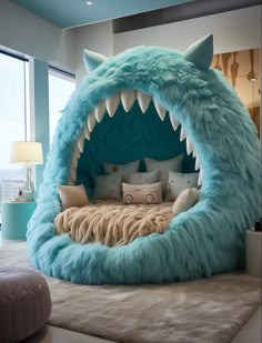 a bed made to look like a monster's mouth with pillows on the bottom