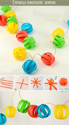 an ornament is made out of paper balls and string with strings attached to it