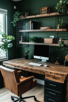 a home office with green walls and wooden shelves