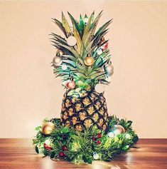 a pineapple sitting on top of a wooden table