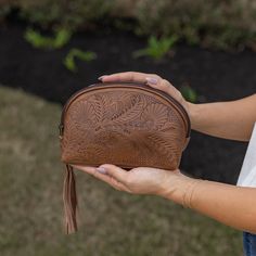 "What makes this so special is that it is a high quality imported leather that has a beautiful, natural sheen, and SOFT leather feel whose durability will last years to come. Many leathers from other countries are hard and stiff. This Paraguayan leather has been perfectly tanned to be soft and supple and will become even softer the older it becomes.  These leather bags and purses are uniquely created ONE AT A TIME by expert leather artisans in Itaugua, Paraguay. Roomy triangle shaped design fits Soft Leather Coin Purse For Daily Use, Daily Use Soft Leather Coin Purse, Artisan Style Bag With Removable Pouch, Everyday Hand-tooled Leather Pouch, Brown Hand Tooled Pouch, Hand Tooled Pouch Bag For Daily Use, Leather Clutch For Gift, Hand Tooled Travel Clutch, Hand Tooled Coin Purse