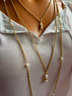 🤗The Pearl Set Necklace is a good option for jewelry lovers, you can wear it in any way you desire . Consists of three different sizes rows, which makes it wearable for any ocasions and even as a daily look. The largest raw is 90 cm long , as a necklace on the neck it is 45 cm and it has closure . This raw can be used in two ways , thirst option is to wear it as a long necklace or you can transform it into a 2 layered choker as the clasp makes it possible to wear . The chai is non allergic gold filled bronze. The middle raw length is 35 cm length and the last raw is 25 cm length and ive added an extra extension chain to adjust the size.  ❗ Feel free to contact me for your different size request . Each item is individually wrapped in craft jewelry gift box. If you want to add a gift note t Gold Long Chain, Long Chain Necklace, Set Necklace, Pearl Set, Long Chain, Daily Look, Jewelry Lover, Jewelry Gift Box, Long Necklace