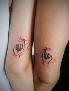 two women with matching tattoos on their arms