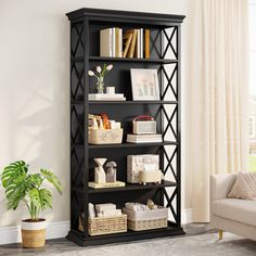 a black bookcase with baskets and books on it