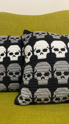 two crocheted pillows with skulls on them