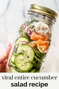 a mason jar filled with cucumber salad ingredients and the words, virtual entire cucumber salad recipe