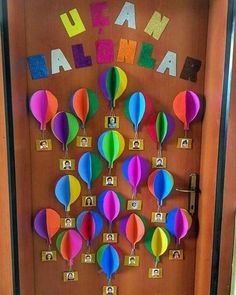 a door decorated with colorful hot air balloons and the word team california written on it