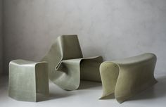 three different shaped chairs sitting next to each other