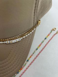 Hat chains - accessorizing your hats. "Navy" everyday go to layer gold curb chain. 3mm width attached lobster clasp on each end measuring 9". Listing is for one gold hat chain ATTENTION: ALL SALES FINAL NO RETURNS OR REFUNDS. Removable Double Lobster Clasp Tarnish Resistant Chain Emily Colvard x BD "In my mom era" hat can be purchase on Stitchin' Pretty's website. stitchinpretty.com Trucker Hat Chain Diy, Trucker Hat Chains, Custom Hat Ideas, Pearl Hat, Hat Chain, Hat Charms, Pretty Website, In My Mom Era, Hat Bar