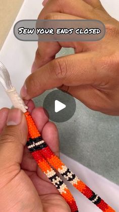 two hands are holding an orange and black beaded object with the words, sew your ends closed