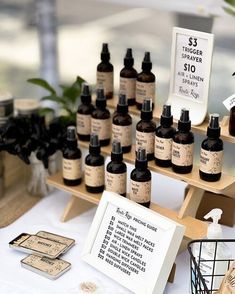 a table topped with lots of bottles of liquid