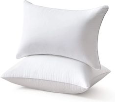 two white pillows stacked on top of each other