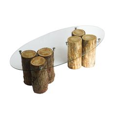 a glass table with logs on it