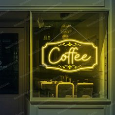 a neon sign in the window of a coffee shop