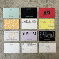 several business cards laid out on top of each other with different font and numbers in them