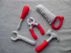 the tools are made out of felt and have red handles