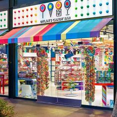 a store front with colorful candy and lollipops on display