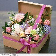 there is a box with flowers in it and the words happy b - day written on it