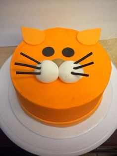 a cake with an orange cat's face on it