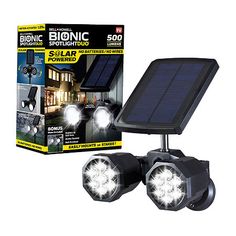 two solar powered spotlights are shown in front of a box with the light on it