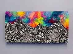 an abstract painting on a wall with mountains in the background and colorful clouds above it