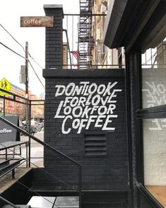 graffiti on the side of a building that says don't look for love, look for coffee