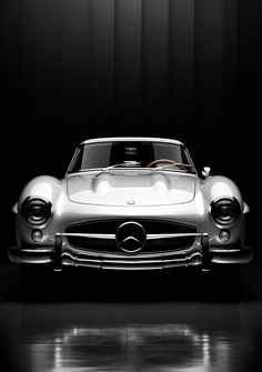 an old mercedes sports car is shown in this black and white photo