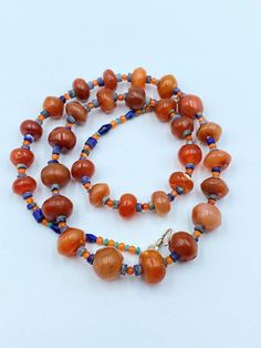 The Beautiful Old Ancient Carnelian Beads Necklace Some Lapis Beads Are Used As Spacers in the Necklace The Age Of this Bead are More Than 2000 Years Old This Carnelian Beads Was Used As Amulet ,Prayer Beads ,Trade and Jewelry in Ancient Himalayan Regions Conditions Of Beads Are Clearly Shown in the Pictures Price Is Negotiable So Please Do not Hesitate To Make an Offer Best Gift for the people who collect Ancient Beads and study Ancient History Fast and Free Shipping Enjoy Beads Traditional Orange Beads For Jewelry Making, Carnelian Colorful Beads For Jewelry Making, Traditional Orange Beaded Necklace With Polished Beads, Bohemian Carnelian Beaded Necklace With Polished Beads, Bohemian Carnelian Beaded Necklaces With Round Beads, Traditional Orange Beaded Necklaces With Polished Beads, Traditional Orange Beaded Necklace With Gemstones, Spiritual Orange Beaded Necklaces With Oval Beads, Colorful Carnelian Beads For Jewelry Making