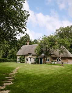 a house that is sitting in the grass