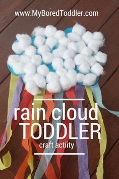 a paper bag with cotton balls in it and the words rain cloud toddler craft activity