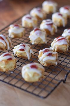 small pastries with icing on a cooling rack, ready to be baked or eaten