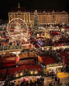 an aerial view of a christmas market at night