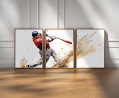 three framed photographs of baseball players on a wooden floor in front of a white wall