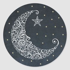 a crescent moon with stars and swirls on it