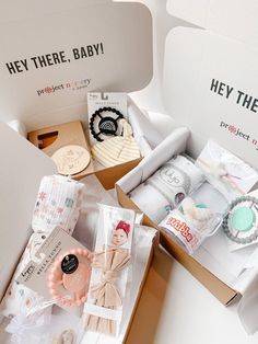 an open box with baby items inside it