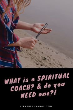 a woman holding scissors on the beach with text overlay that reads, what is a spiritual coach & do you need one?